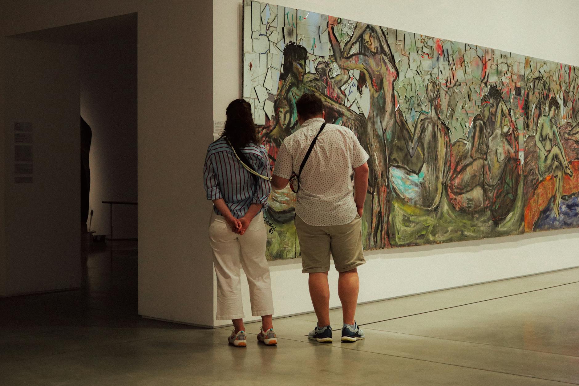 Visitors enjoying an art exhibition in a modern gallery