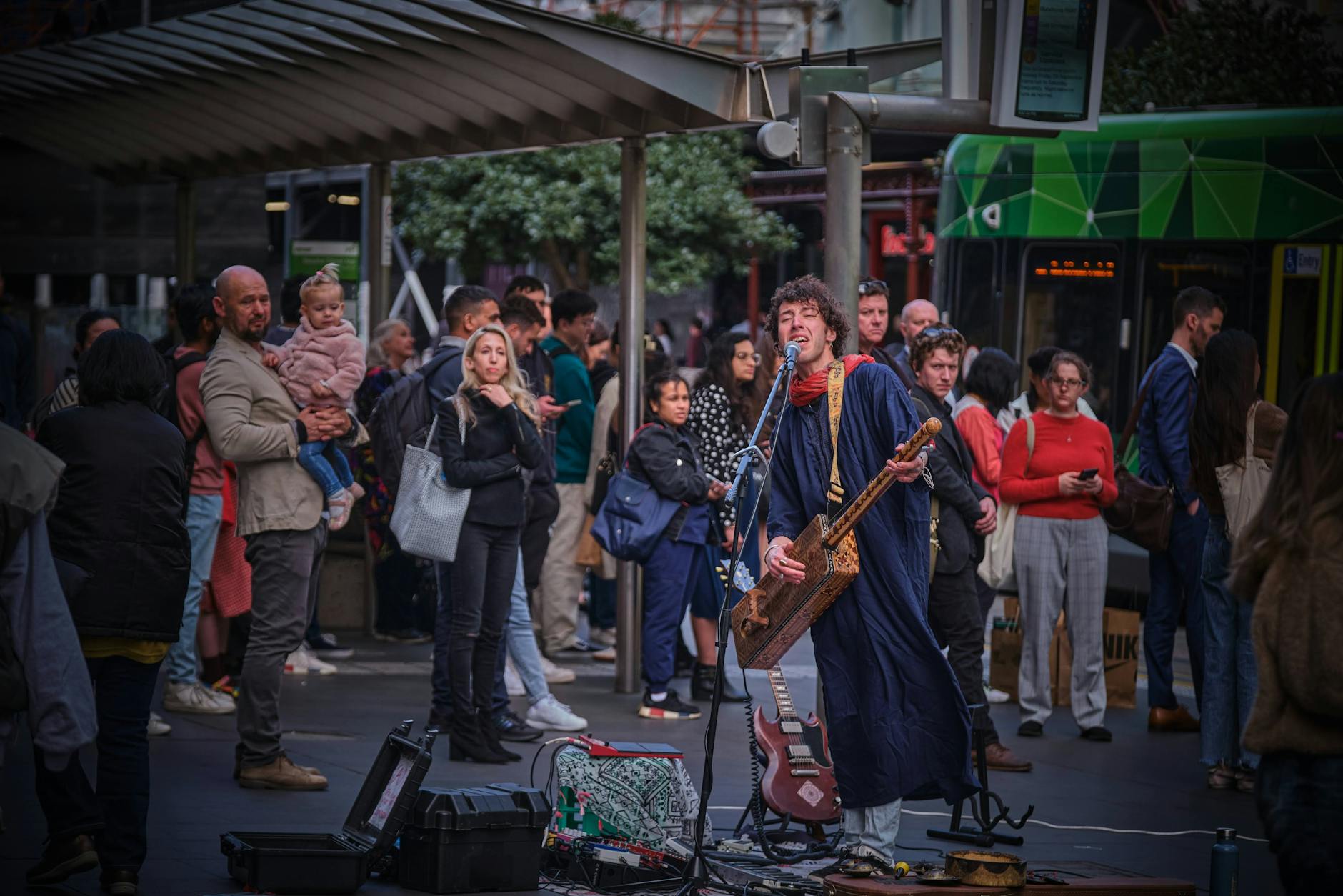Street performer entertaining crowds in a city centre