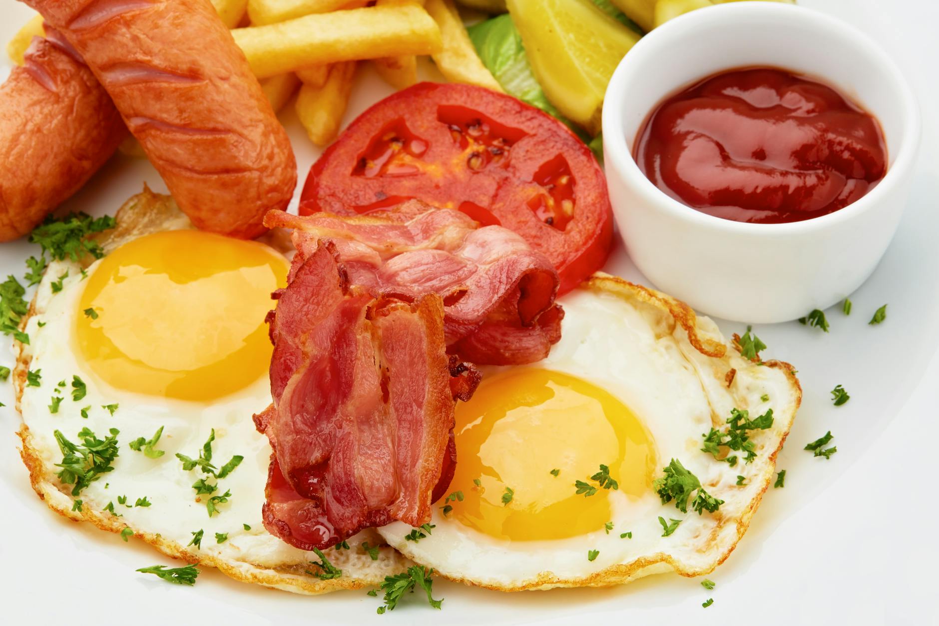 Full Irish breakfast with sausages bacon eggs and pudding