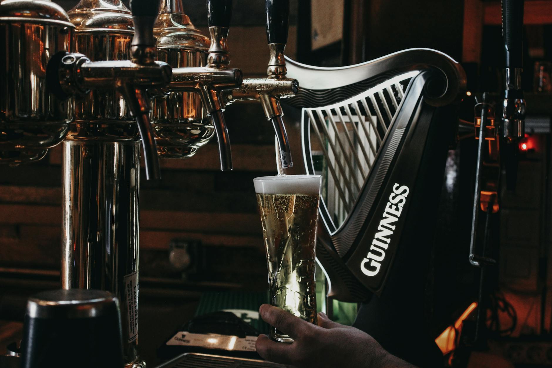 Perfect pint of Guinness being poured in a Dublin pub