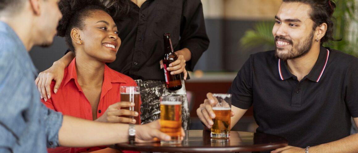 Group of friends celebrating on a night out in a city bar