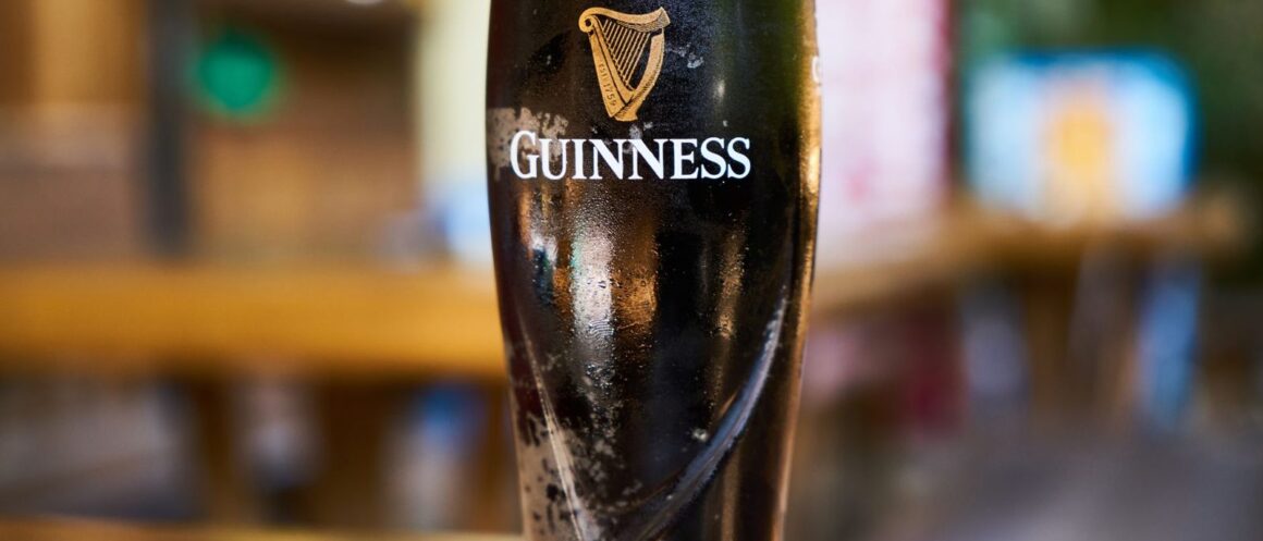 Pint of Guinness settling on a Dublin bar counter