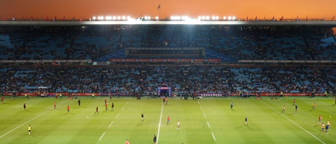 Packed rugby stadium crowd on match day