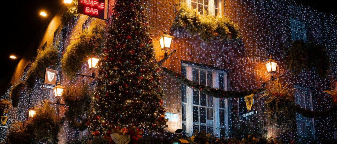 Grafton Street in Dublin under Christmas lights with shoppers