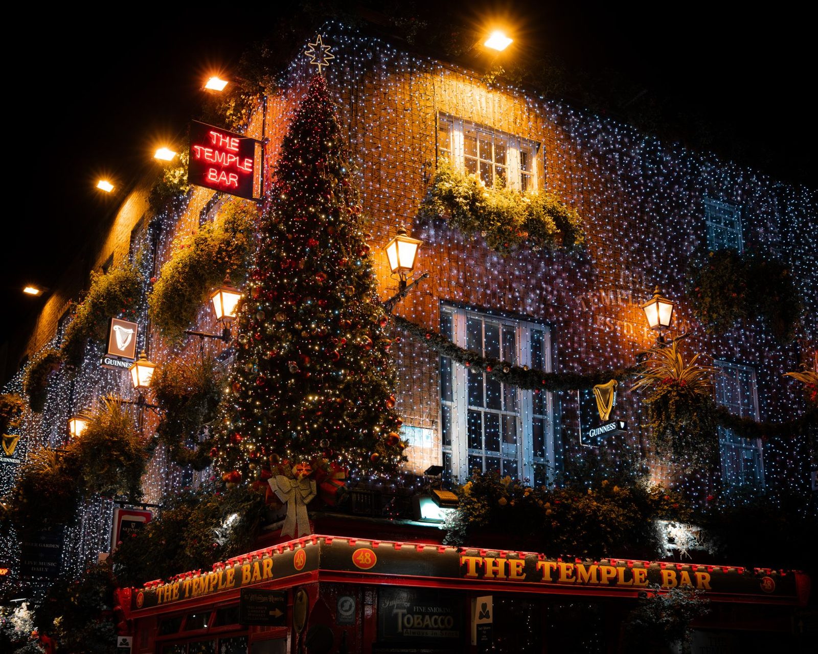 Grafton Street in Dublin under the Christmas lights with shoppers in November