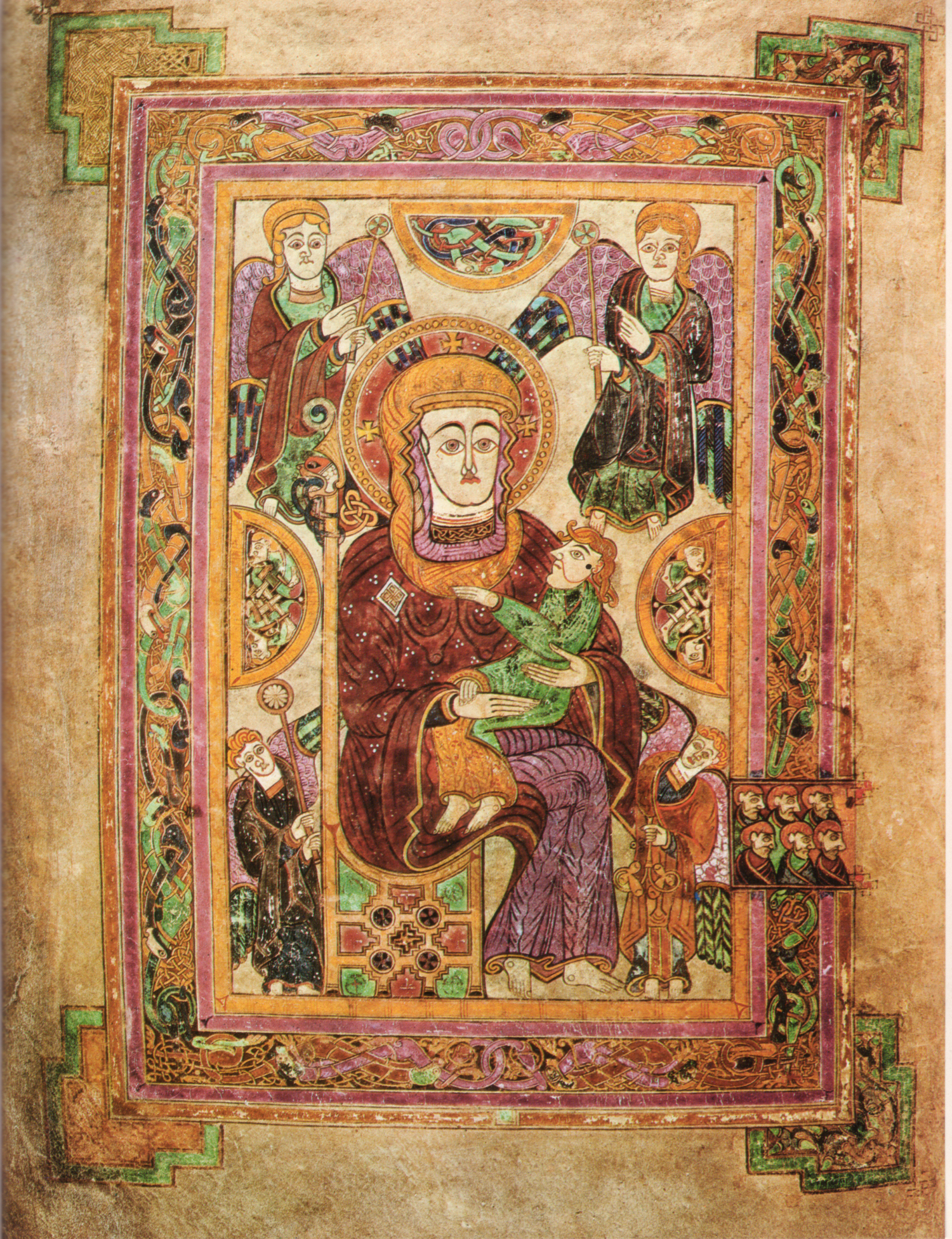 The Book of Kells' Virgin and Child page surrounds the seated figures with angels and intricate red, green and purple borders.