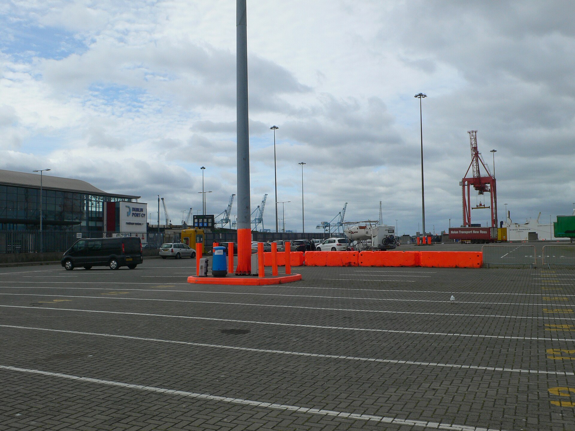 Cars and vans wait behind orange barriers in the ferry vehicle area at Dublin Port.