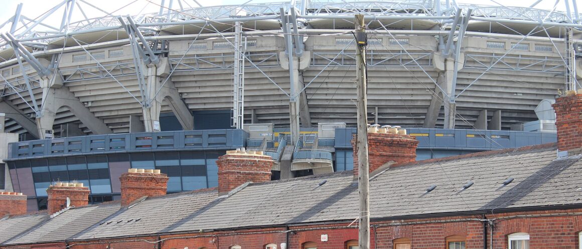 Croke Park stadium towers above a row of red brick terraced houses on Dublin’s northside.