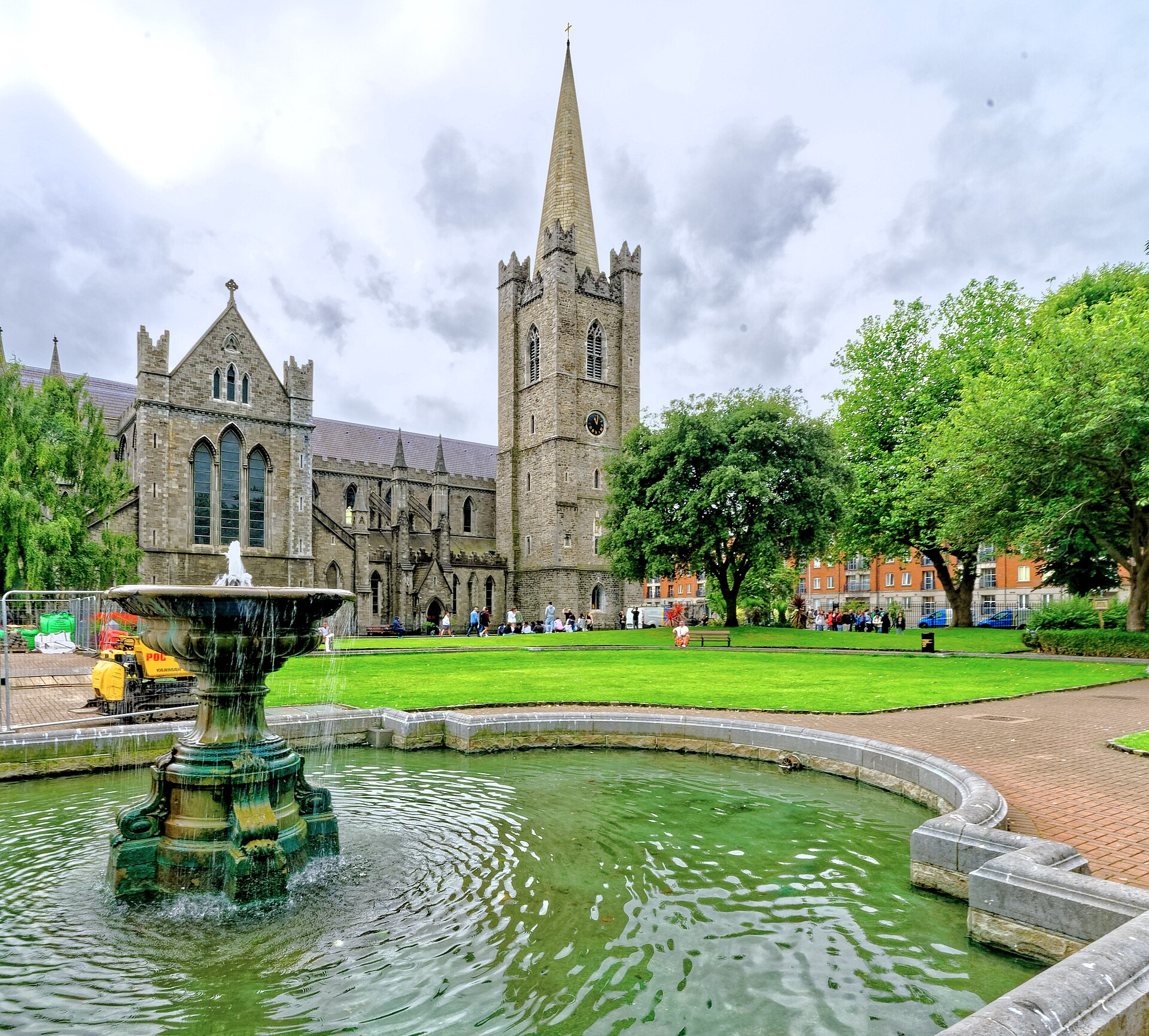 A fountain fills the foreground of St Patrick's Park, with Dublin's cathedral and its spire beyond the lawn.