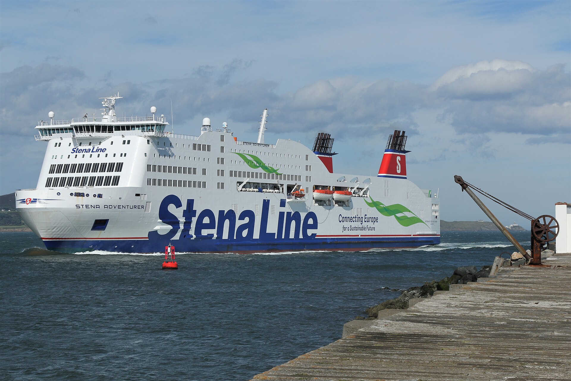 Stena Adventurer passes a harbour buoy and stone pier on its approach to Dublin Port.