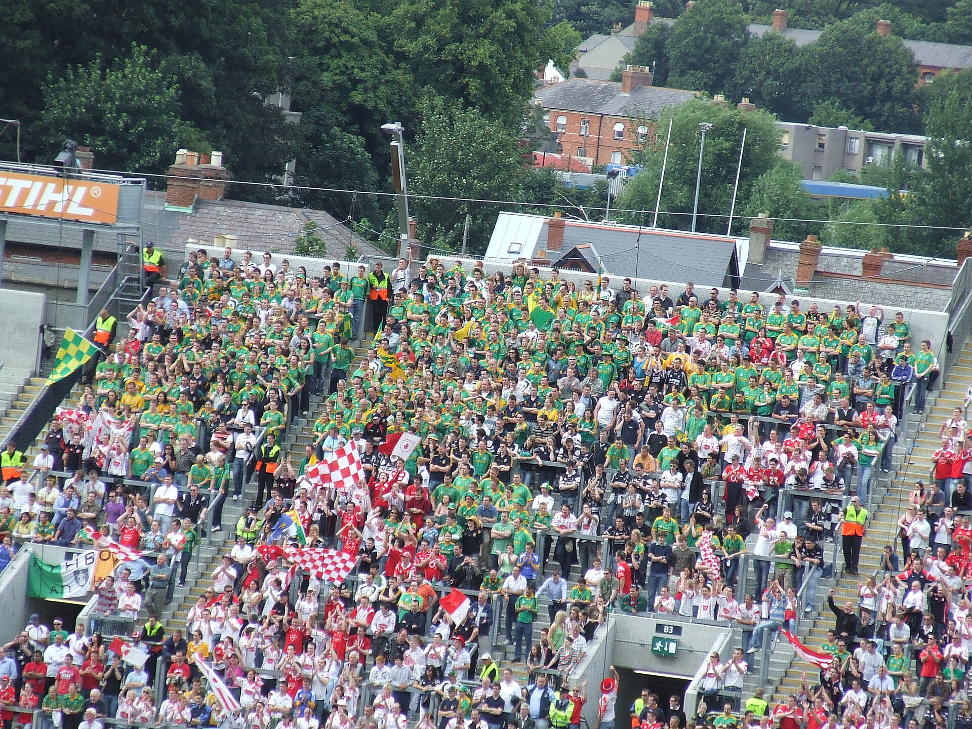 Supporters in green, yellow and red fill Hill 16 at Croke Park in Dublin during a Gaelic football event.